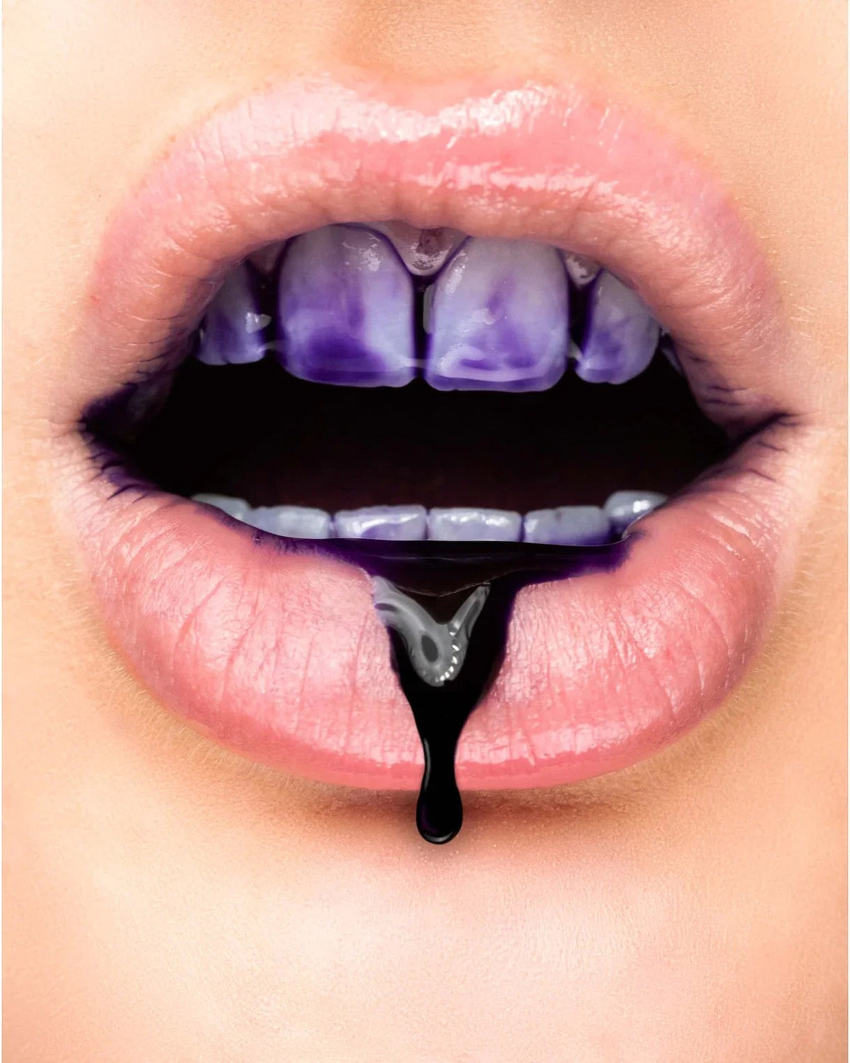Close-up of lips with purple colour corrector on the teeth